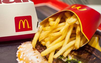 Salty McDonald's fries served on a plastic tray.
